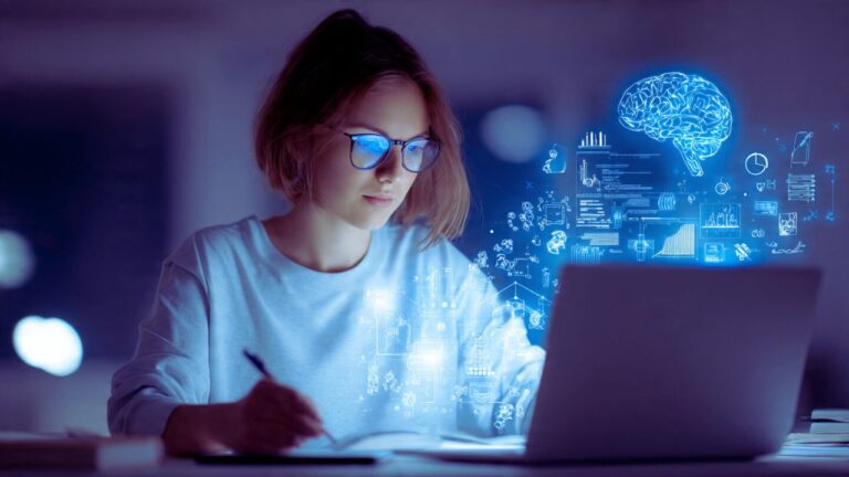 A woman in glasses works on a laptop, with a brain icon displayed on the screen, symbolizing focus or creativity. Best AI Tools for Students